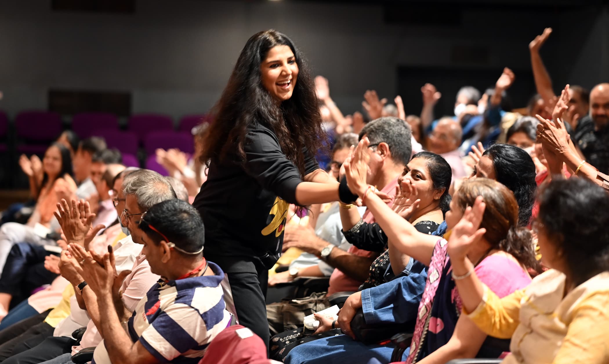 Devaki interacting with audience members during Adbhut